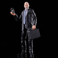Action figure of a man in a suit holding a briefcase and a lock on a black background