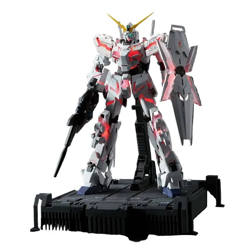 Bandai MGEX 1/100 Unicorn Gundam Ver.Ka model kit in white with glowing red psycho-frame on a black display base.