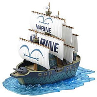 Bandai ONE PIECE Marine Ship model kit featuring white sails with Marine logos on a translucent blue water display base.