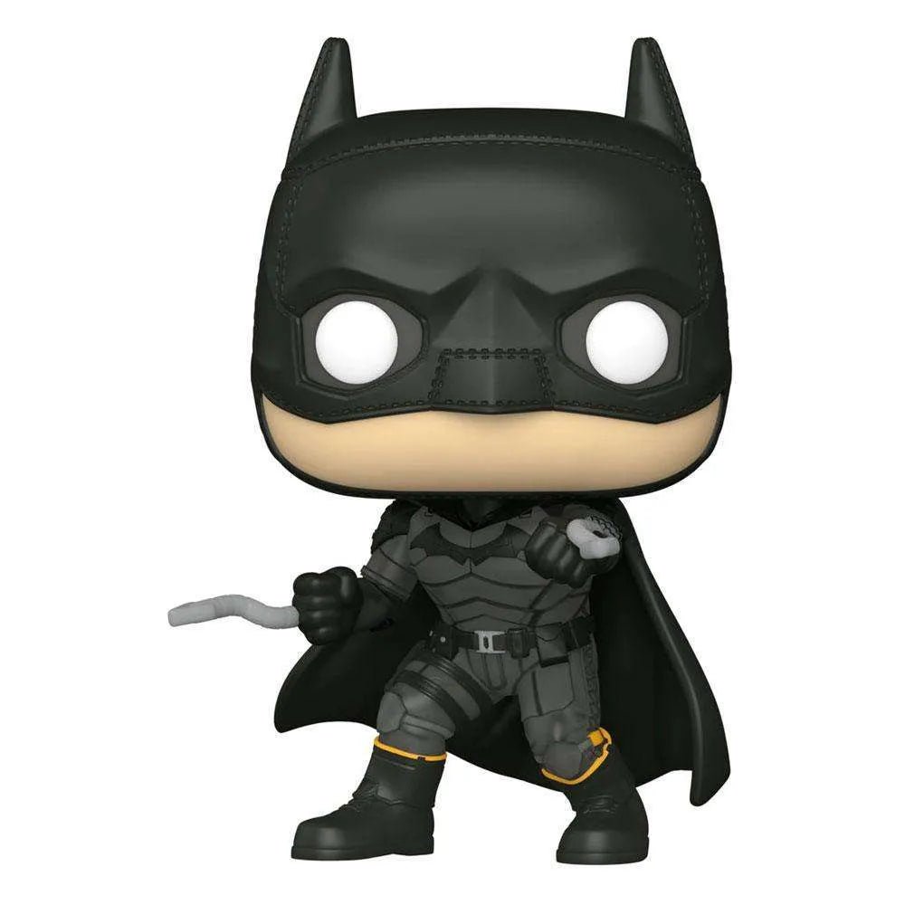 Front view of a 9 cm Funko Batman POP! vinyl figure in a black tactical suit with a grappling hook in his hand.