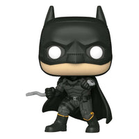 Front view of a 9 cm Funko Batman POP! vinyl figure in a black tactical suit with a grappling hook in his hand.