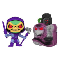 Funko Pop Town Skeletor figure holding a sword and staff next to a purple and grey Snake Mountain vinyl playset.