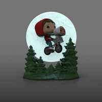 Funko POP! Elliott and E.T. flying on a bicycle in front of a glowing moon with green pine trees at the base.