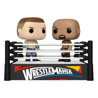 Funko POP! WWE Cena vs Rock vinyl figures in a WrestleMania ring display with white ropes and black corner posts.