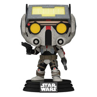 Front view of Tech Funko Pop! #445 wearing a weathered grey helmet with yellow goggles and holding two small blasters.