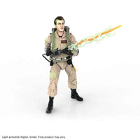 Hasbro Ghostbusters Ray Stanz 6-inch action figure in a tan jumpsuit with a proton pack and glowing green energy blast.