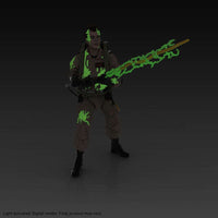 Hasbro Ghostbusters Ray Stantz Plasma Series figure in a tan jumpsuit with glow-in-the-dark slime and proton beam effects.