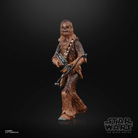 Hasbro Star Wars Black Series Chewbacca action figure in a front-facing pose holding his signature bowcaster weapon.
