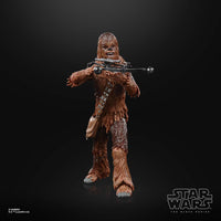 Hasbro Star Wars Black Series Chewbacca action figure holding his signature bowcaster weapon against a black background.