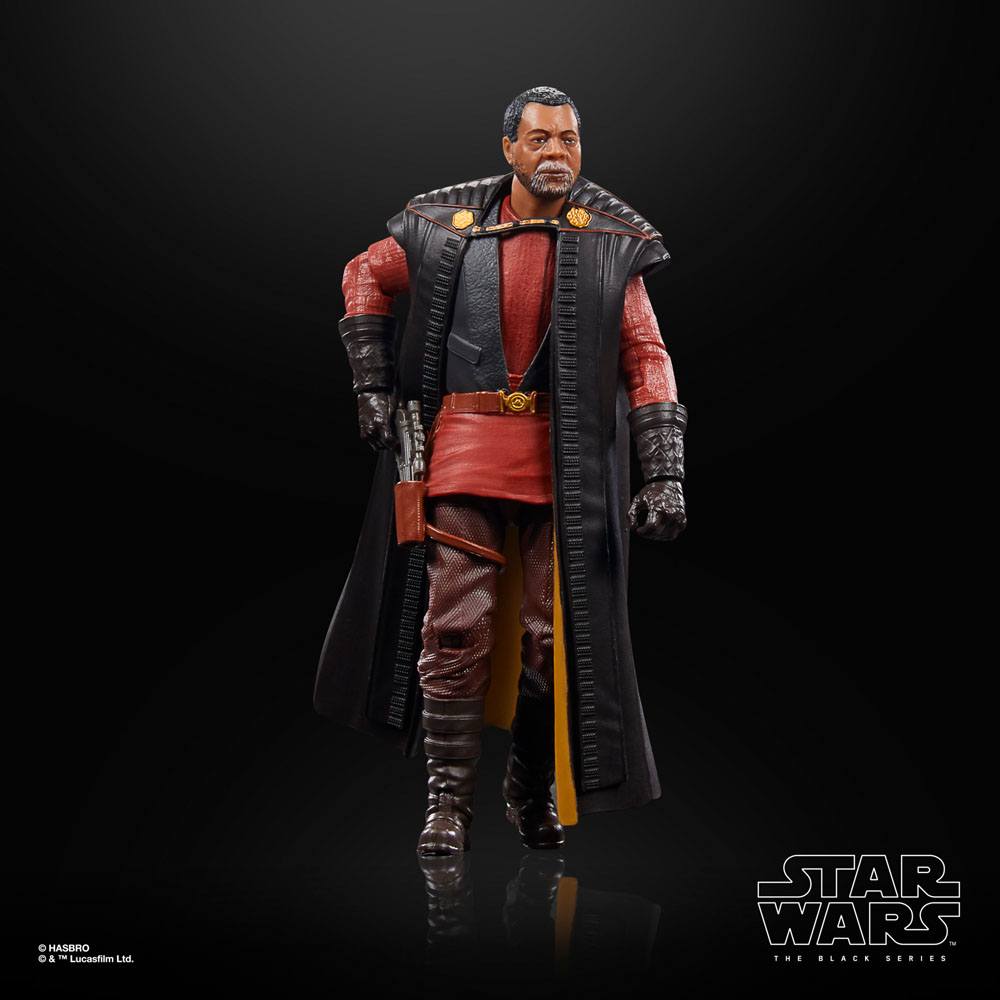 Hasbro Star Wars Black Series Greef Karga action figure wearing a long black coat over a red tunic and brown pants.