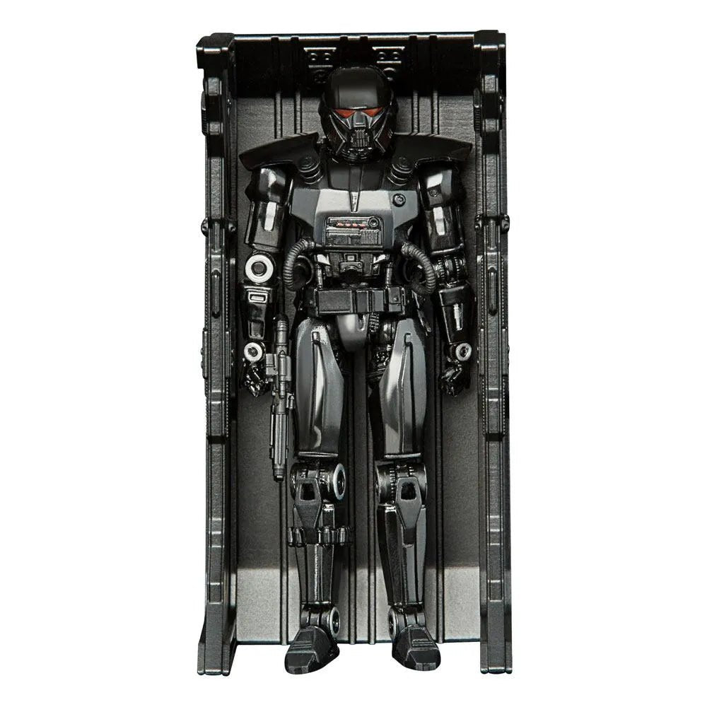 Hasbro Star Wars Mandalorian Dark Trooper action figure in black armor, displayed inside its vertical storage locker.