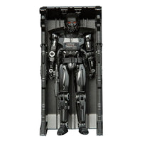 Hasbro Star Wars Mandalorian Dark Trooper action figure in black armor, displayed inside its vertical storage locker.