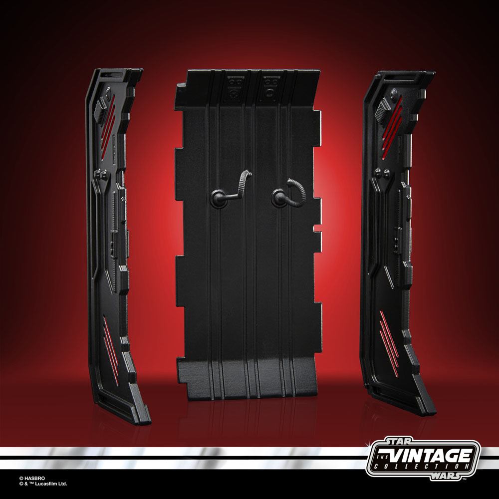Black plastic Dark Trooper charging station panels from The Vintage Collection with red accent detailing.