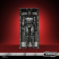 Hasbro Star Wars The Vintage Collection Dark Trooper action figure in a black storage locker against a red background.