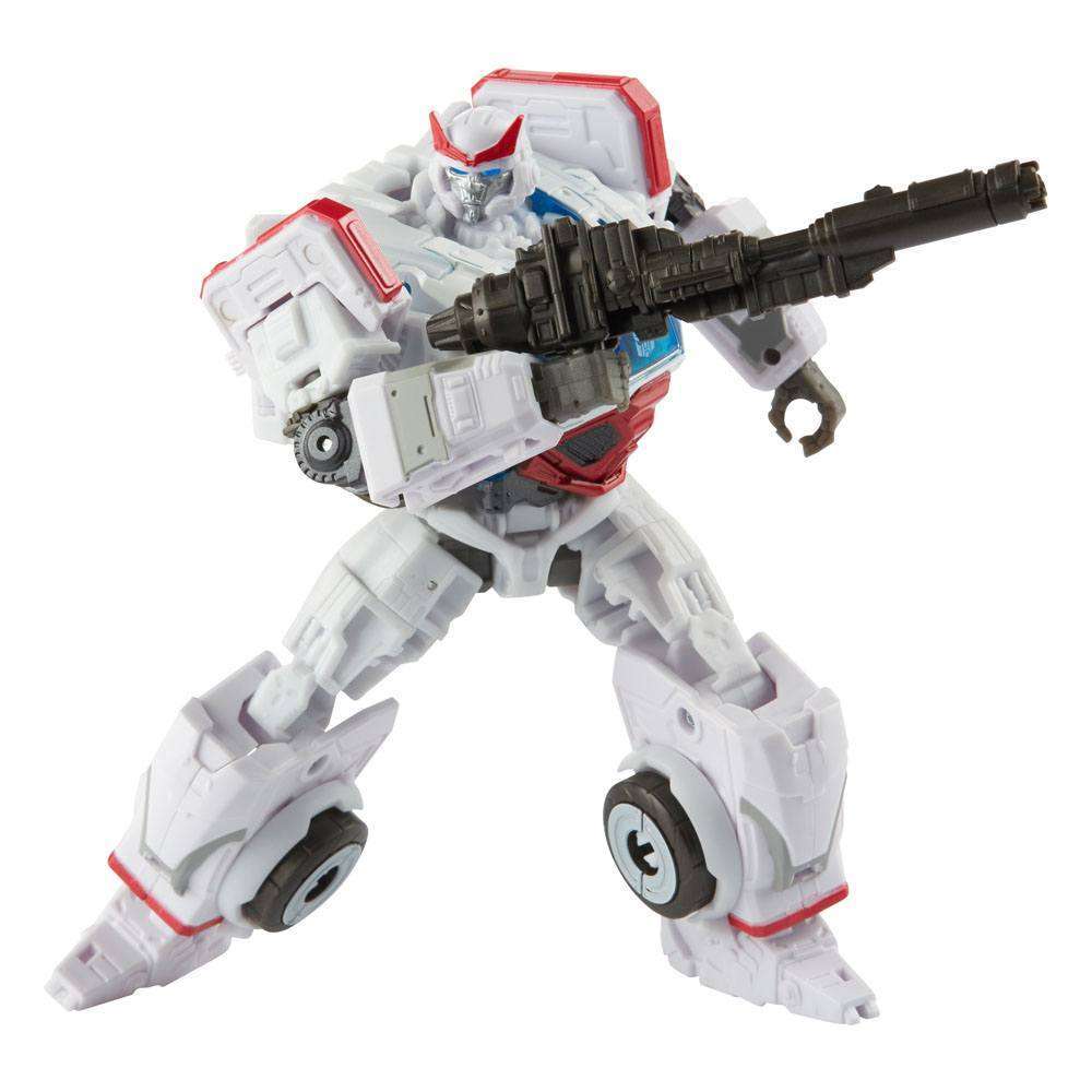 Hasbro Transformers Studio Series Autobot Ratchet action figure in robot mode holding a black blaster weapon.