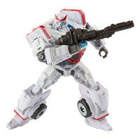 Hasbro Transformers Studio Series Autobot Ratchet action figure in robot mode holding a black blaster weapon.
