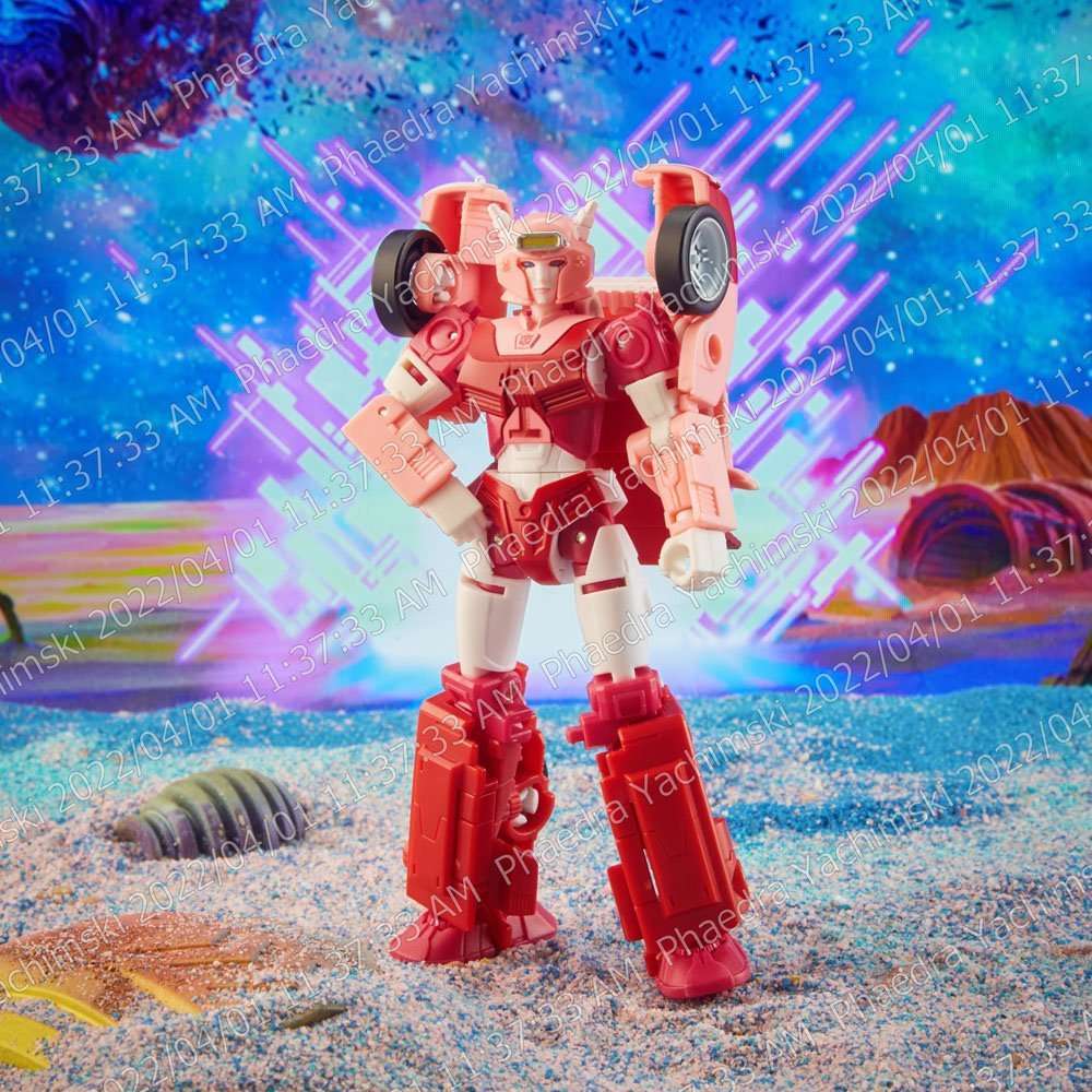 Hasbro Transformers Legacy Elita-1 action figure in a standing front view, featuring pink and white robotic armor.