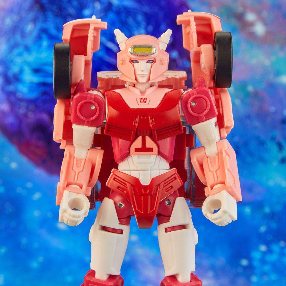 Front view of Hasbro Transformers Legacy Elita-1 action figure in pink, red, and white against a blue space background.