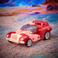Hasbro Transformers Legacy Elita-1 action figure in vehicle mode, a pink and white sports car with black wheels.