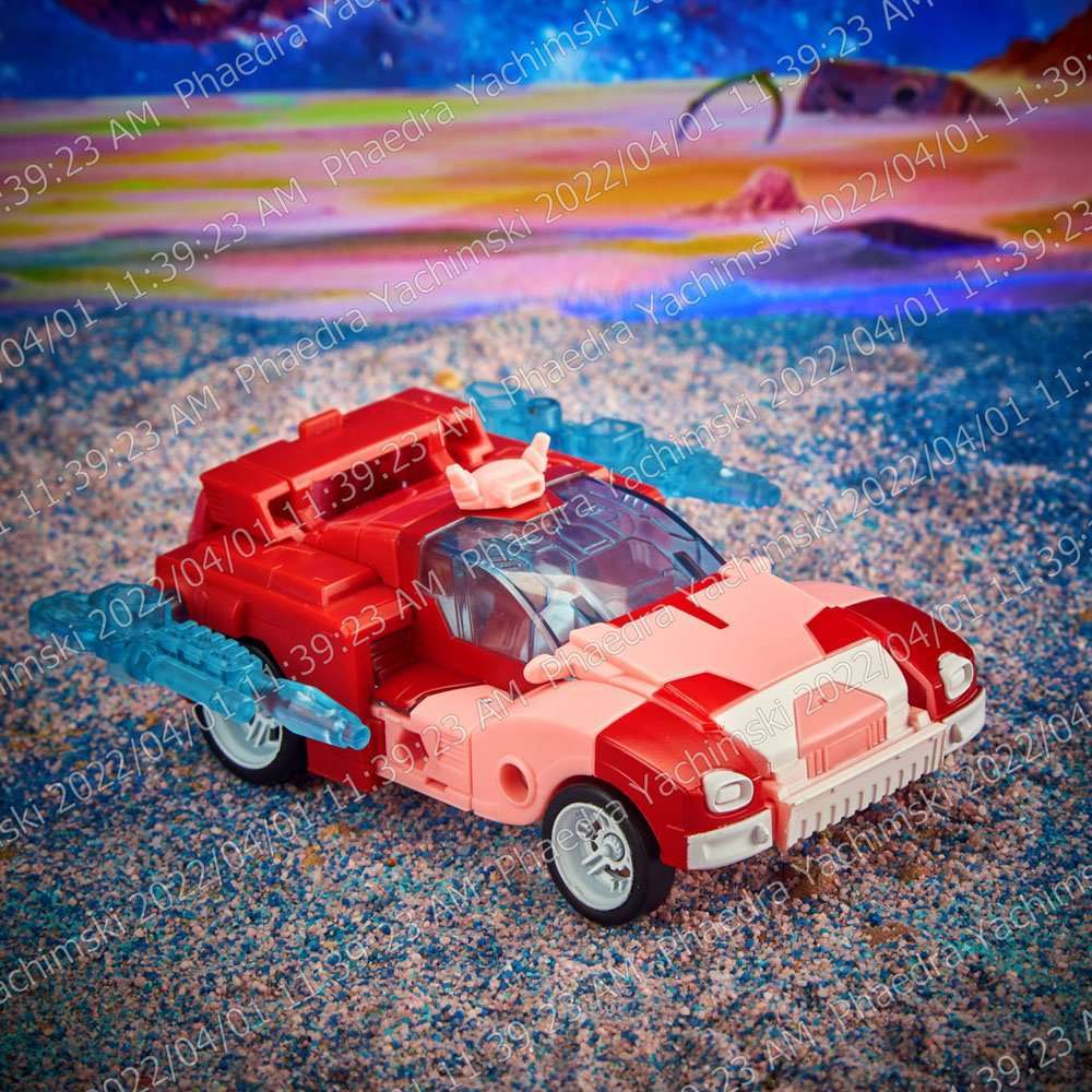 Hasbro Transformers Legacy Elita-1 action figure in red and white sports car vehicle mode, viewed from the side.