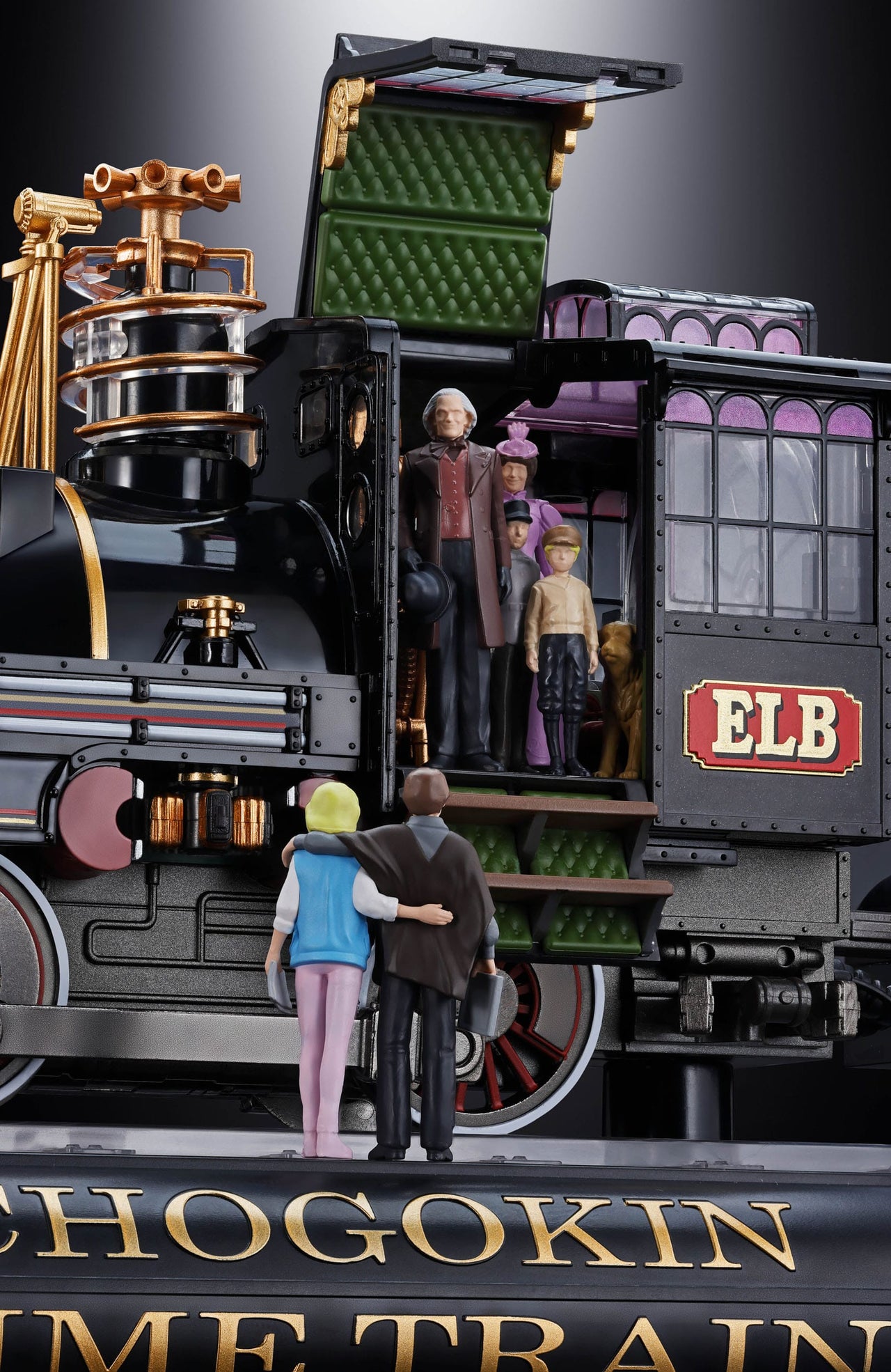 Model train set with figures and 'ELB' branding on a dark background