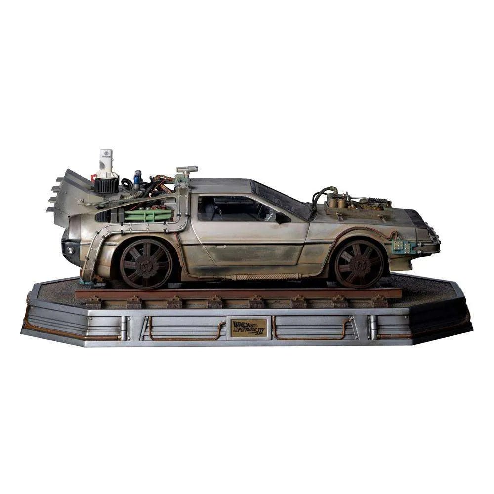 Side view of the 1/10 scale Iron Studios Back to the Future III DeLorean statue on a detailed railroad track base.