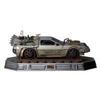 Side view of the 1/10 scale Iron Studios Back to the Future III DeLorean statue on a detailed railroad track base.