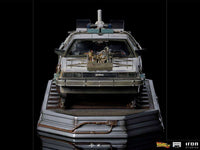 Front view of the Iron Studios 1/10 scale Back to the Future III DeLorean statue on a detailed railroad track base.