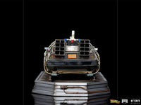 Rear view of the Iron Studios Back to the Future III 1/10 scale DeLorean statue with detailed metallic engine parts.