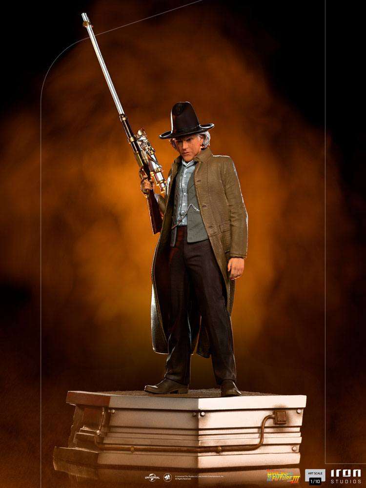 Iron Studios 1/10 Doc Brown statue from Back to the Future III, featuring Doc in a cowboy outfit holding a long rifle.