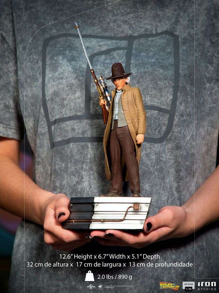 Iron Studios 1/10 Doc Brown statue from Back to the Future III, featuring the character holding a rifle on a base.