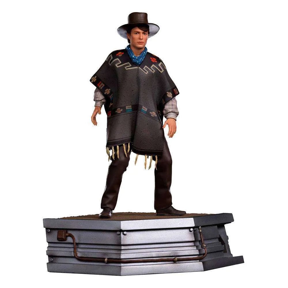 Iron Studios 1/10 Marty McFly statue from Back to the Future III wearing a poncho and hat on a detailed display base.
