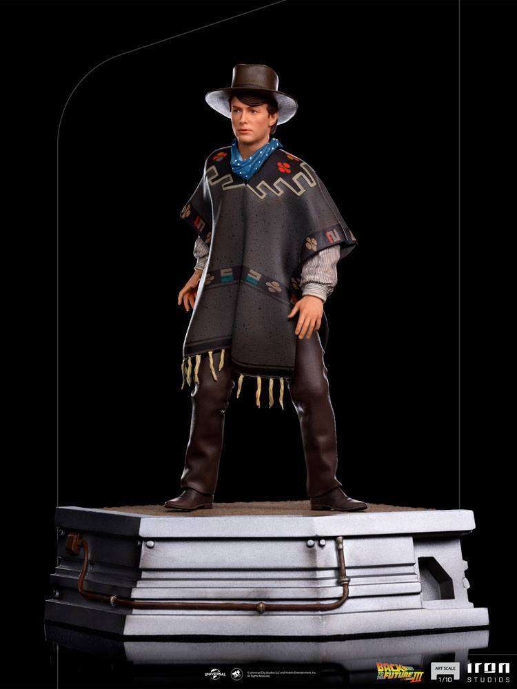 Iron Studios 1/10 Marty McFly statue from Back to the Future III, featuring him in a cowboy hat and poncho on a base.