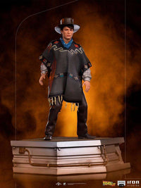Front view of the 23cm Iron Studios Marty McFly statue from Back to the Future III wearing a poncho and cowboy hat.