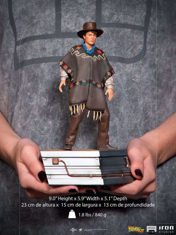 Iron Studios 1/10 scale Marty McFly statue from Back to the Future III, wearing a poncho and hat on a themed base.