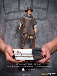 Iron Studios 1/10 scale Marty McFly statue from Back to the Future III, wearing a poncho and hat on a themed base.