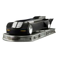 Iron Studios 1/10 scale Batmobile from Batman The Animated Series on a detailed silver display base, side view.