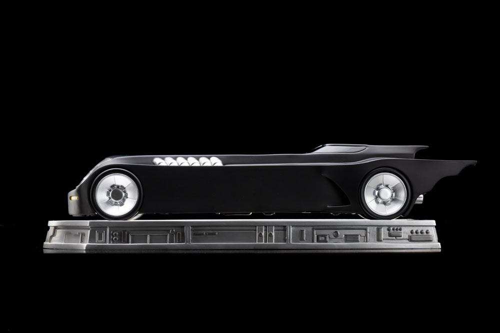 Side view of the Iron Studios 1/10 scale Batmobile from Batman The Animated Series on a detailed display base.