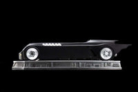 Side view of the Iron Studios 1/10 scale Batmobile from Batman The Animated Series on a detailed display base.