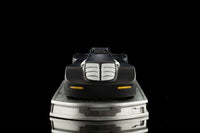Front view of the Iron Studios Batman The Animated Series 1/10 Batmobile in matte black on a metallic display base.