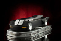 Side view of the matte black Iron Studios Batman The Animated Series Batmobile 1/10 scale statue on a metallic base.