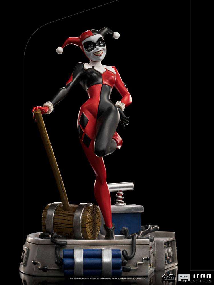 Iron Studios 1/10 Harley Quinn statue from Batman The Animated Series, featuring her iconic red and black jester suit.