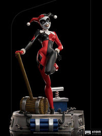 Iron Studios 1/10 Harley Quinn statue from Batman The Animated Series, featuring her iconic red and black jester suit.