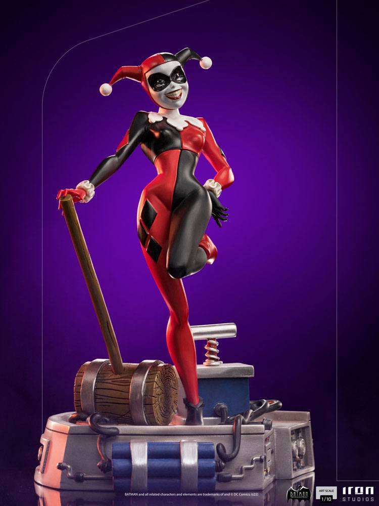 Iron Studios 1/10 Harley Quinn statue from Batman The Animated Series, featuring her iconic jester suit and mallet.