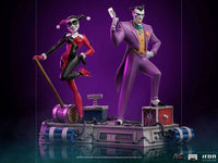 Iron Studios 1/10 Harley Quinn and Joker statues from Batman The Animated Series on a themed base.