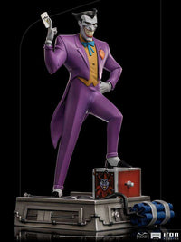 Iron Studios 1/10 Joker statue from Batman The Animated Series, wearing a purple suit and holding a playing card.