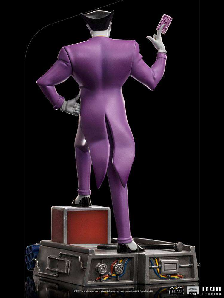 Back view of Iron Studios Batman The Animated Series Joker 1/10 scale statue in a purple suit holding a playing card.