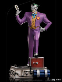 Iron Studios Batman The Animated Series Joker 1/10 scale statue in a purple suit, holding a playing card on a base.