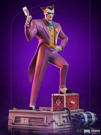 Iron Studios 1/10 scale Joker statue from Batman The Animated Series, featuring a purple suit and jack-in-the-box base.