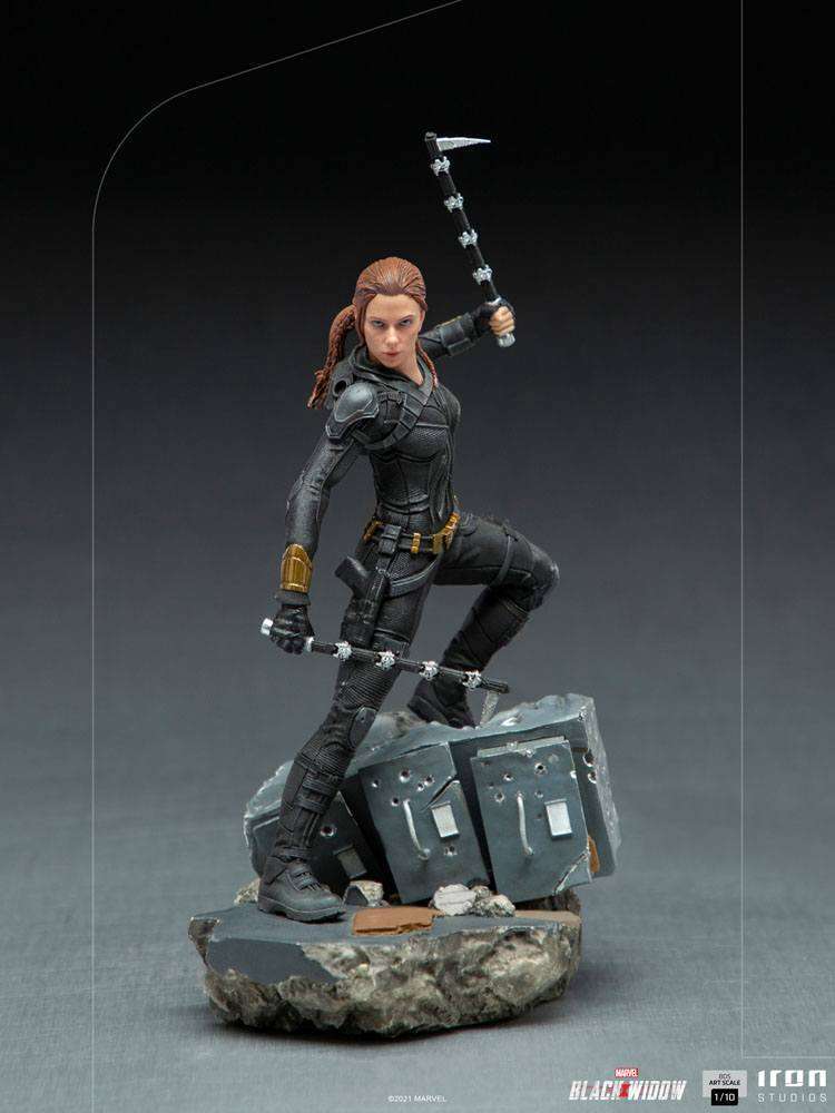 Iron Studios Black Widow 1/10 scale statue in a black tactical suit, holding batons on a rubble-textured display base.